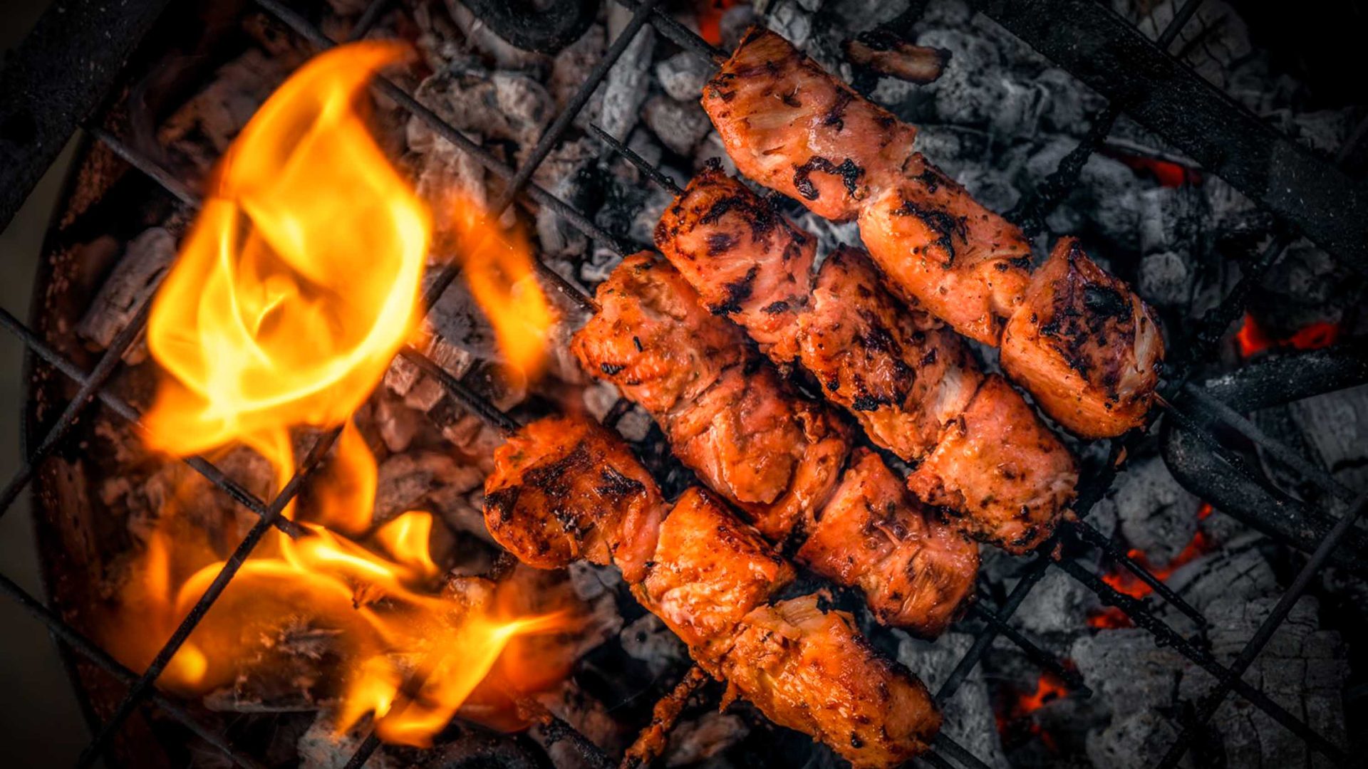 Meat roasting on a BBQ.