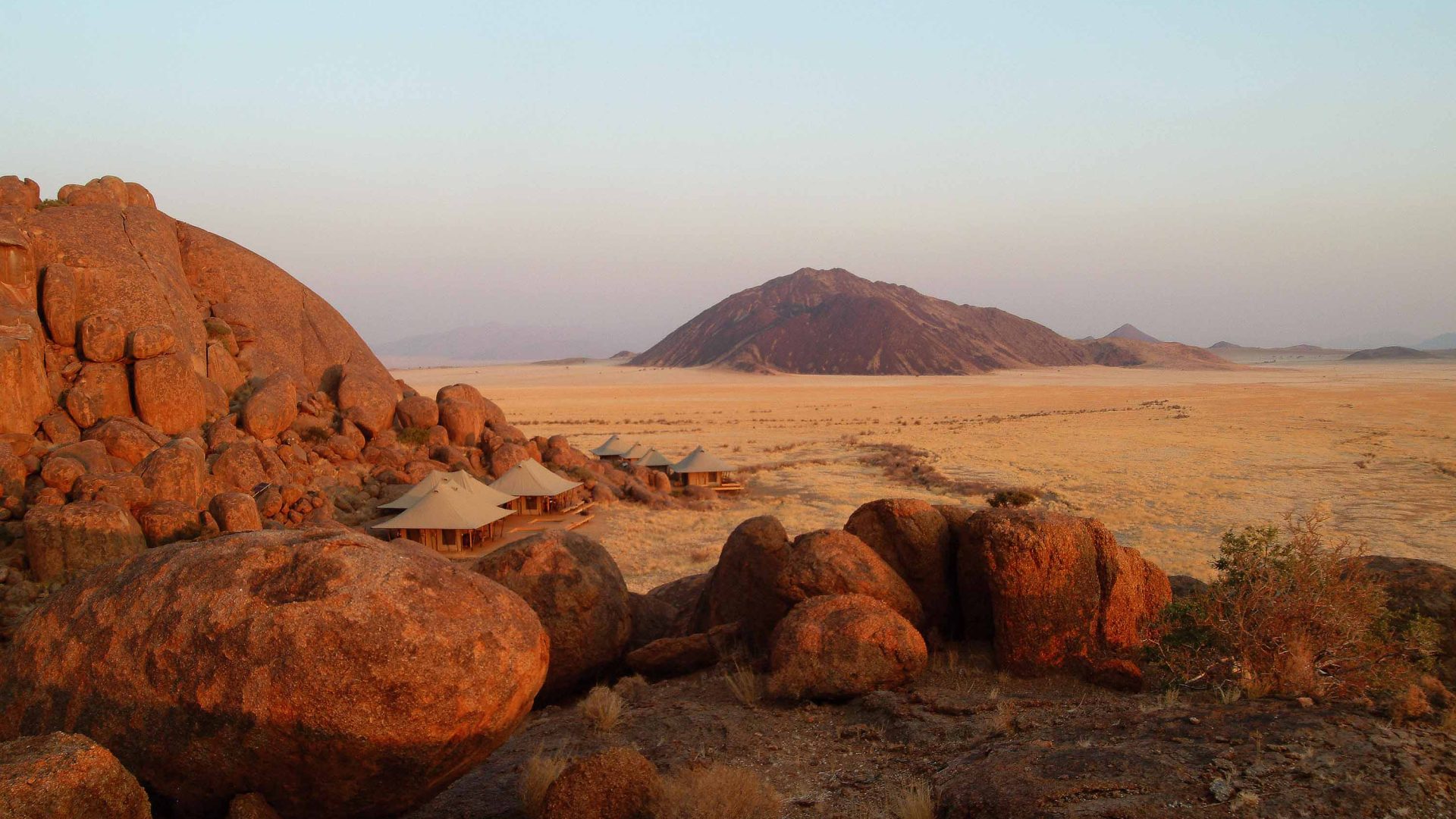 Camps are nestled amongst big red boulders.