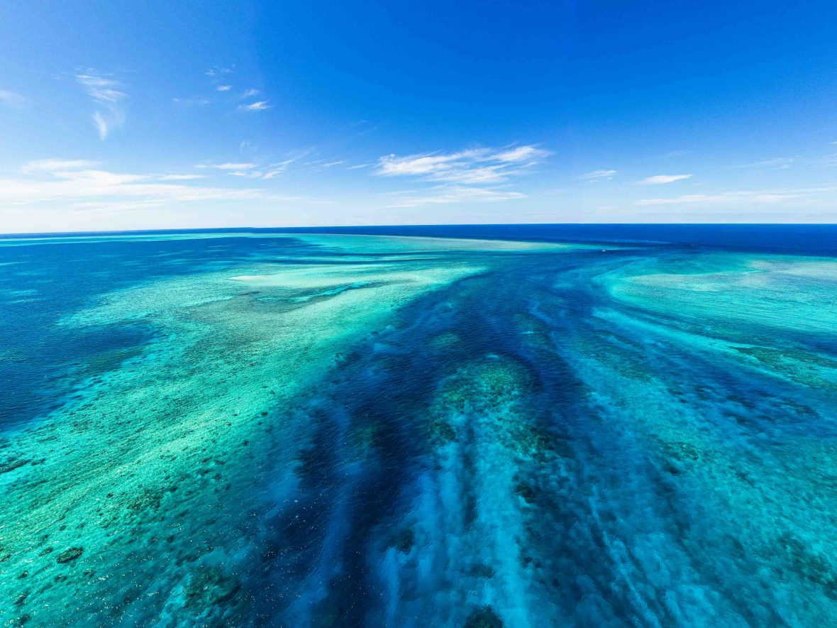 View of reefs in blue water.