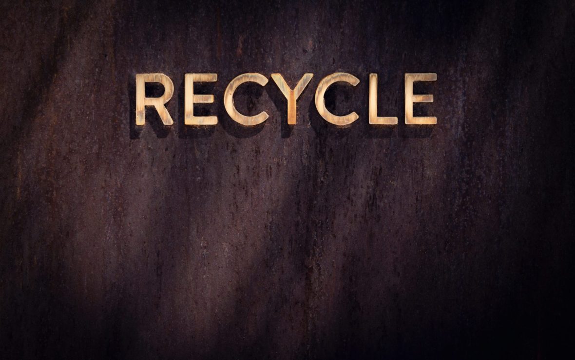 The word 'Recycle' against a brown background