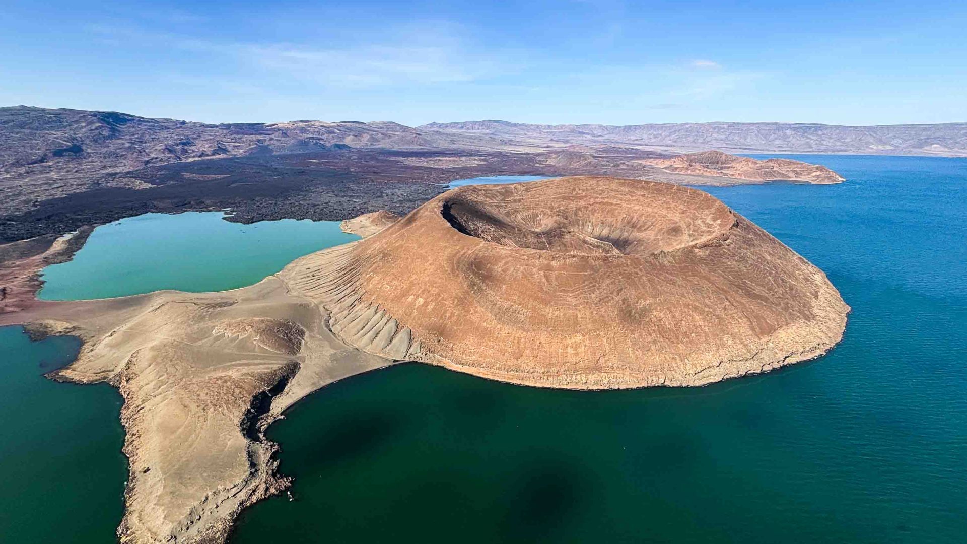 Photo: A lake and a crater as seen from the air.