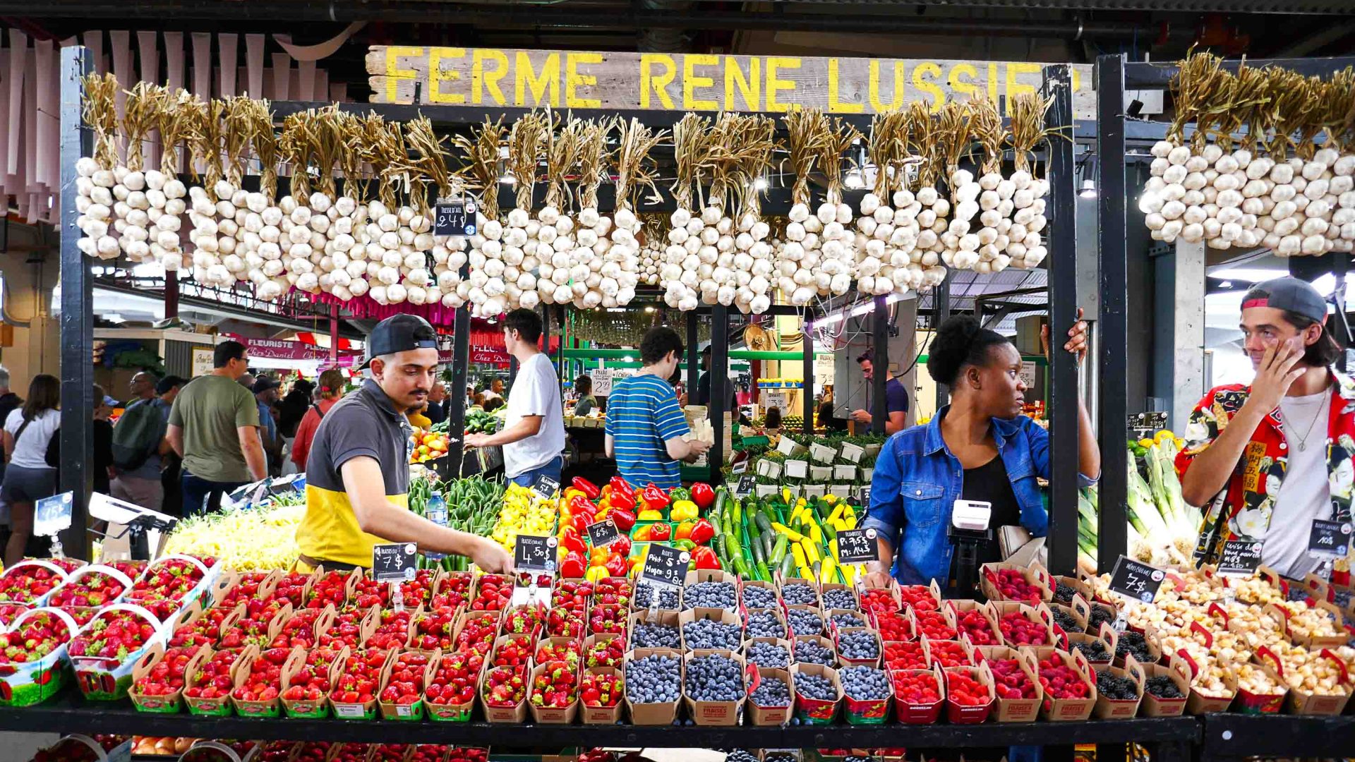 Fresh produce at market stands.