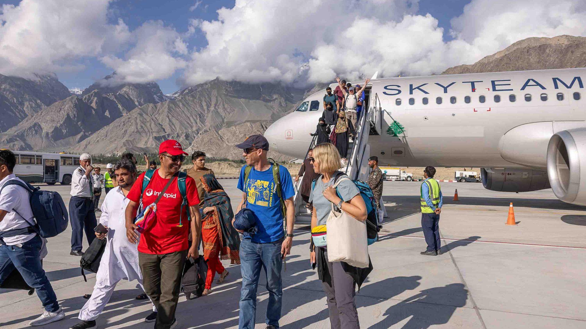 Muneer Alam greets travellers as they get off the plane at Skardu Airport.