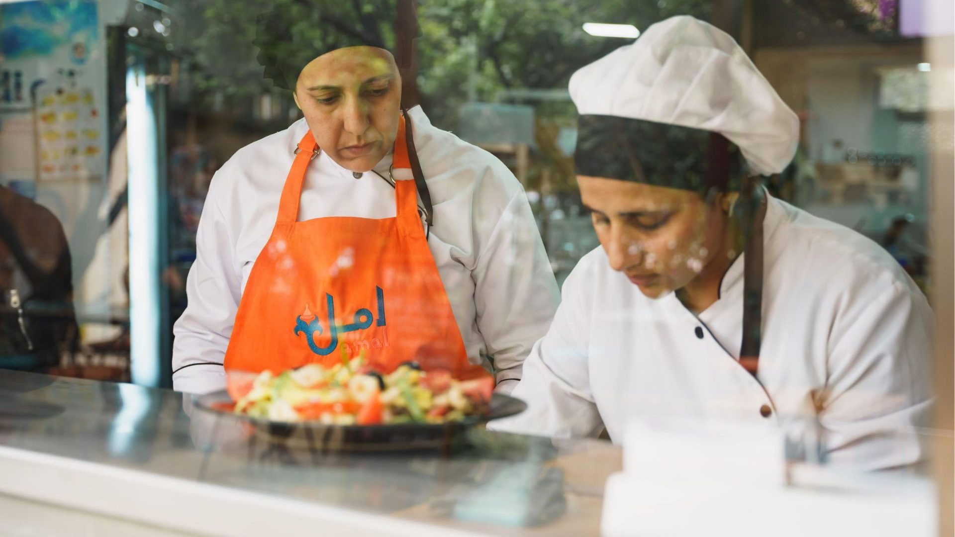 Two women prepare food in Marrakech