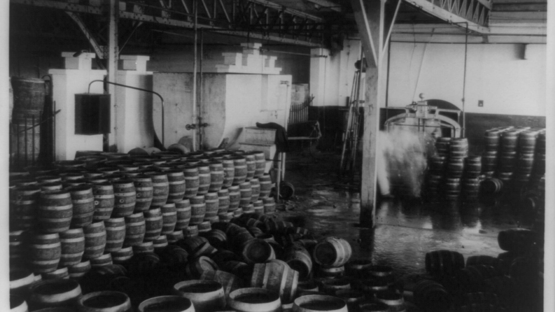 Barrels of confiscated liquor in a building.