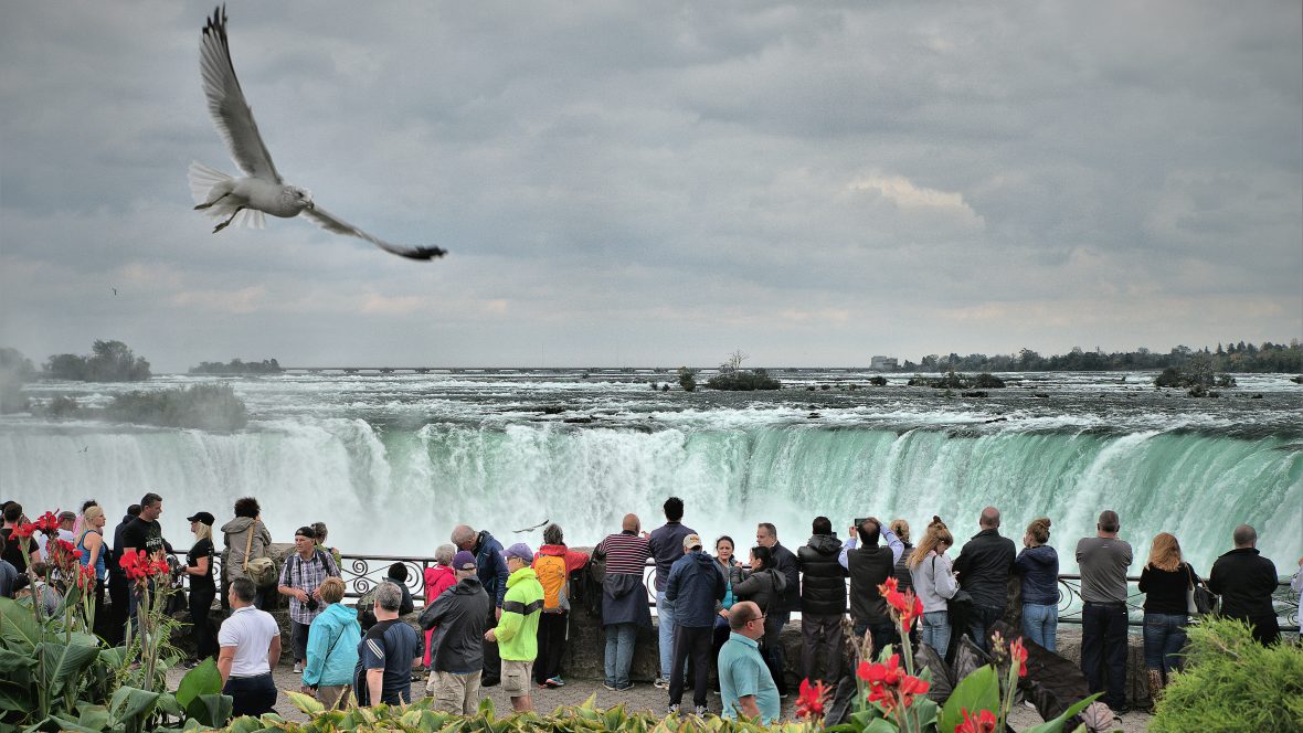 Tourists crowd Niagara Falls.