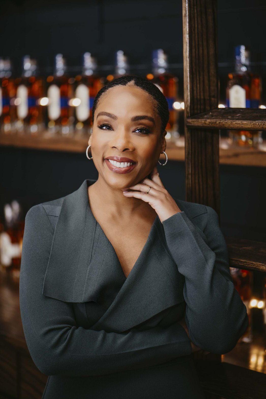 A portrait of a woman smiling to camera.