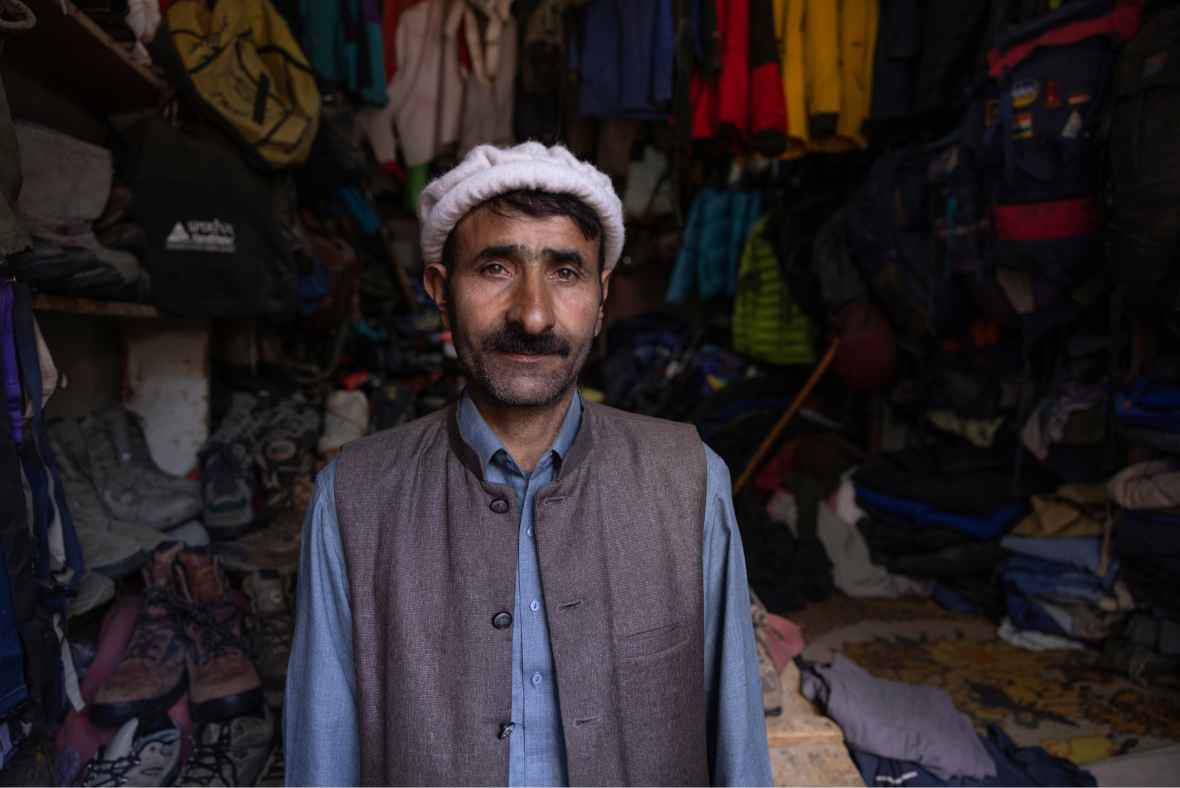 Pakistani man stands in his shop