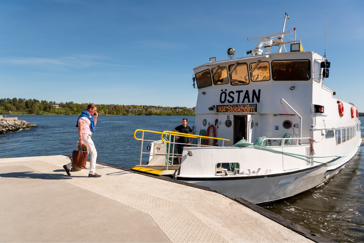 man walking onto ferry in stockholm